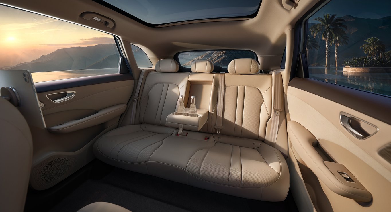 Rear view of the SAIC H5 in Splendid Apricot interior, showcasing the rear cabin layout and cup holders